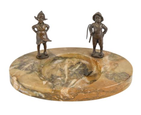 An art deco bronze mounted siena marble ashtray, c1930,&nbsp;designed as a pond set with the figures of a Dutch boy with fish