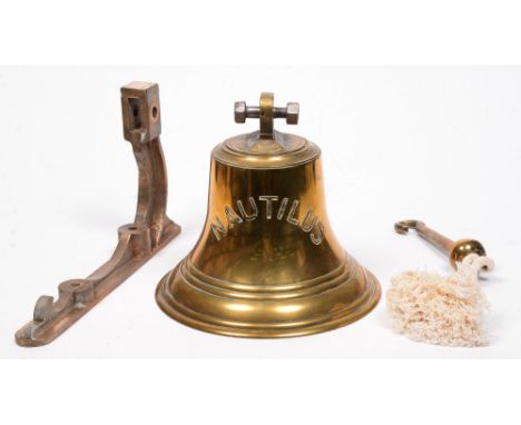 Maritime interest. A brass ship's bell, inscribed NAUTILUS, first half 20th c, with clapper and oak handle, 26cm h, and a bro