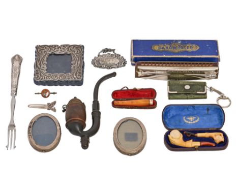 A pair of George V miniature oval silver photograph frames, 78mm h, marks rubbed, Birmingham 1919 and miscellaneous articles,