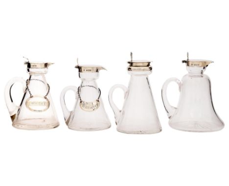 Four Edwardian and George V silver mounted glass whisky noggins, 11 and 11.5cm h, London and Birmingham, various makers and d