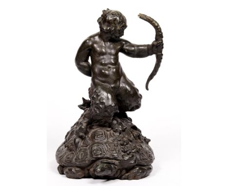 A bronze sculpture of a faun on a tortoise, early 20th c, uneven dark green patina, 41cm h Bow held in the figure's left hand