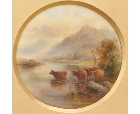 A Royal Worcester plaque, 1917, painted by J Stinton, signed, with highland cattle in a misty landscape, 10.5cm diam, puce pr