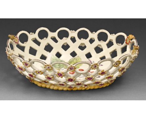 A Derby 'spectacle' basket, c1760, sprigged with yellow florets above yellow enamel rope footrim, enamelled to the interior w