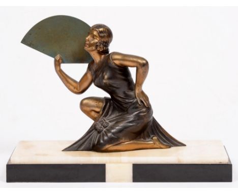 An Art Deco bronzed and gilt spelter statuette of a woman, c1930, on onyx base, 28cm l 