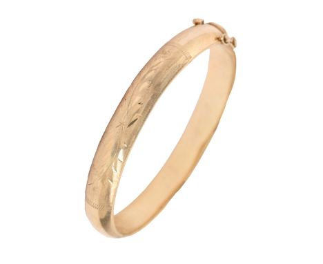 A gold bangle, 60mm internal, marked 9k, 15.7g Light wear scratches