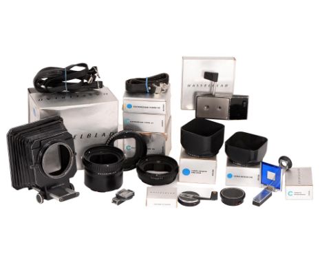 A group of Hasselblad camera accessories, comprising bellows, lens hoods 80 and 100-250, extension tubes 10, 21 and 55, sport