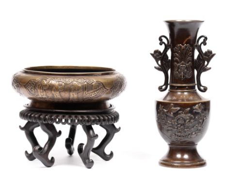 A Chinese bronze bowl, decorated with figures at battle, on a carved and pierced hardwood stand, 25m diam, and a Japanese bro