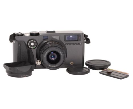 A Hasselblad XPan 35mm panoramic camera, No 11EE18745, with maker's 45mm F4 lens No 8YEE17445, both caps, lens hood and a Ger