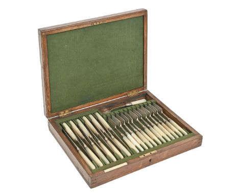 A set of twelve George III mother of pearl hafted silver dessert knives and forks, crested, maker IT, London 1801 and 1803 an