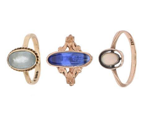 An opal ring, in 9ct gold, marked 9ct, another gem set gold ring and a base metal ring with blue cabochon, 4g excluding the l