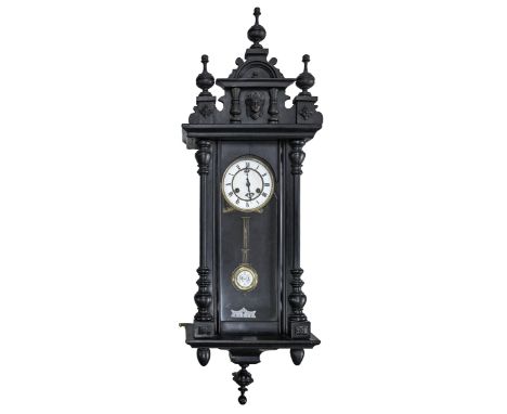 An ebonised Vienna wall clock,&nbsp;c.1900, with white enamel dial and pendulum bob, 95cm h 