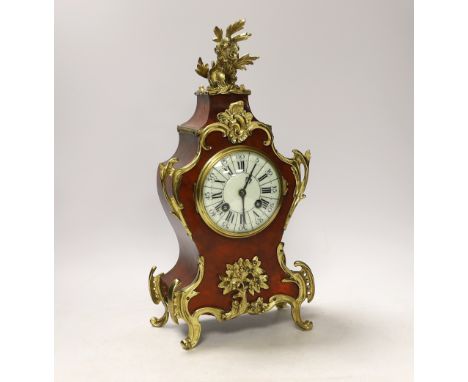 A Louis XV style tortoiseshell and ormolu mounted mantel clock with enamel Roman numeral dial, 35cm high