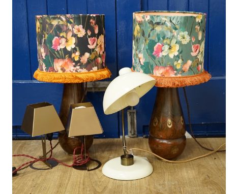 A pair of WMF bronzed metal bedside lamps, a smaller pair and a desk lamp, 36cm high