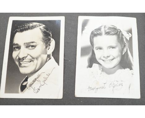 A vintage black and white photograph album with some autographs including Lucille Ball and Margaret O’Brien