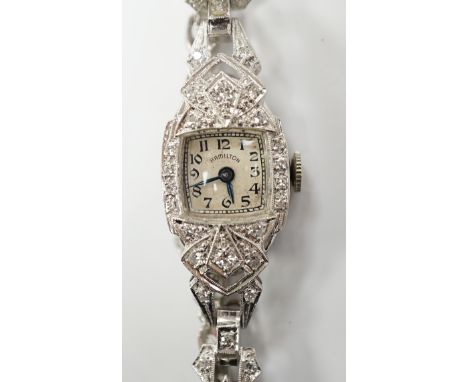 A lady's white metal (stamped irid and platinum) and diamond cluster set manual wind Hamilton cocktail watch, approx. 15cm, g