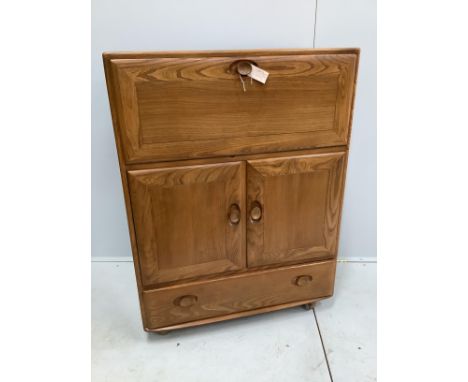 An Ercol elm bureau / cabinet, width 82cm, depth 44cm, height 109cm No label present