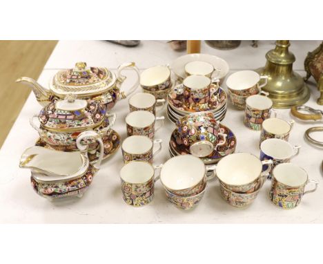 An early 19th century Derby Japan pattern part tea and coffee set, including cups and saucers, teapot, milk jug and bowl