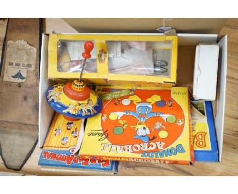 An early 20th century cased Bussey’s Hawk kite, a black walkie talkie doll, a four slot money box, an early Pelham puppet and
