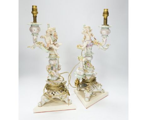 A pair of Sitzendorf floral encrusted porcelain table lamps, 42cm total