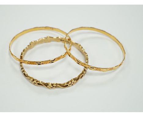 Two 22k bangles, 19.6 grams and a 9ct gold bangle, 20.6 grams.