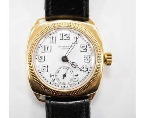 A gentleman's yellow metal J.W. Benson manual wrist watch, with Arabic dial and subsidiary seconds, on a black leather strap.