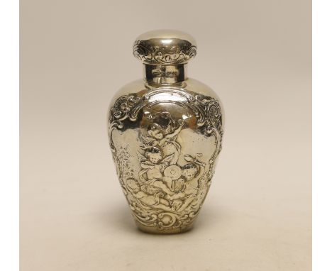 An Edwardian continental embossed silver tea caddy? and cover decorated with amorini, makers stamp to the base, import marks 