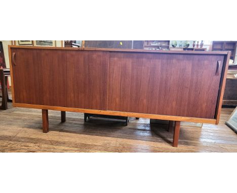 An Ulferts mid-century sideboard with two sliding doors, left side reveals a shelf, right side reveals a cutlery drawer and o