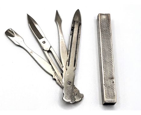 A miniature manicure set in an engine turned case, ALD, Birmingham, 1931 with stainless steel riveted implements. 18.5gms all