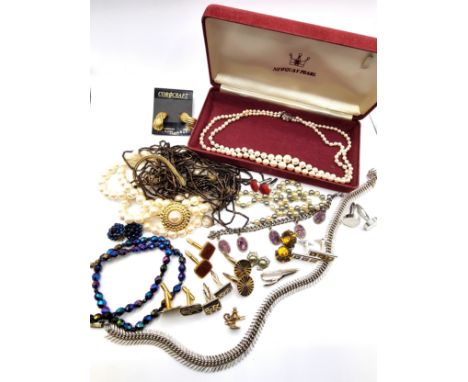 Mixed costume jewellery including double pearl strand, a collection of cuff links and a tie pin,and other boxed items.