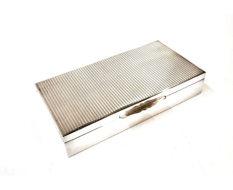 A cigarette box (marks indistinguishable inside lid and on base) with engine turned lid,  wood lined, possibly cedar. 378gms 