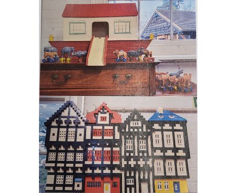 A Lego four-block terraced building with interior electric lighting 52cm wide 35cm high, and a painted wood Noah's Ark with s