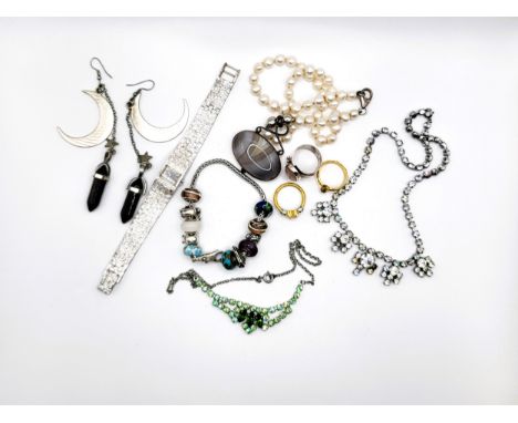 Two paste necklaces, a silver charm bracelet, a cultured pearl and agate necklace, three rings, a pair of earrings, and an Av