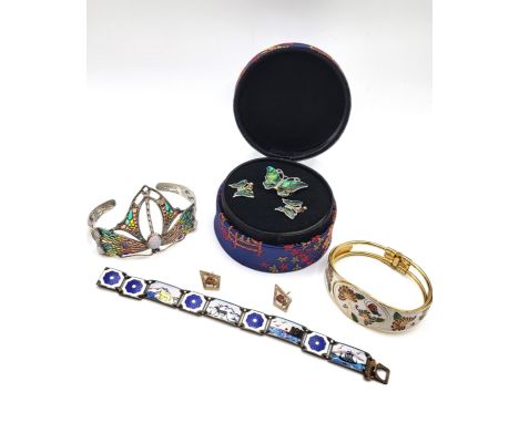 Costume jewellery including a cuff bangle and earrings, a butterfly brooch and matching earrings, a plique du jour cuff bangl