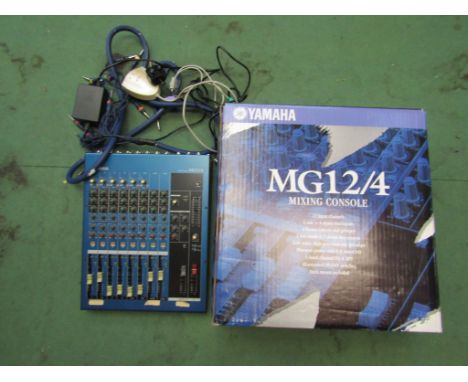 A Yamaha MG124 mixing console, boxed