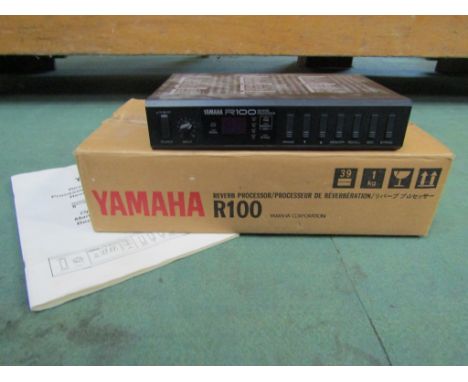 A Yamaha R100 reverb unit and manual 