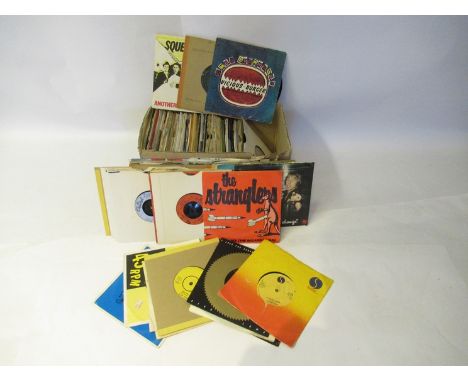 Approximately 120 assorted Rock 7" singles including Elvis Costello, David Bowie, Saxon, Queensryche, Gary Moore, Free, Tyger