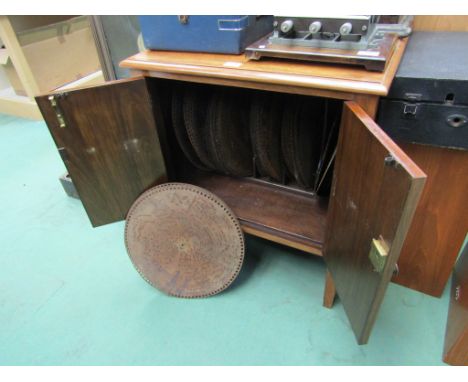 A polyphon cabinet containing a collection of 15 1/2" discs 