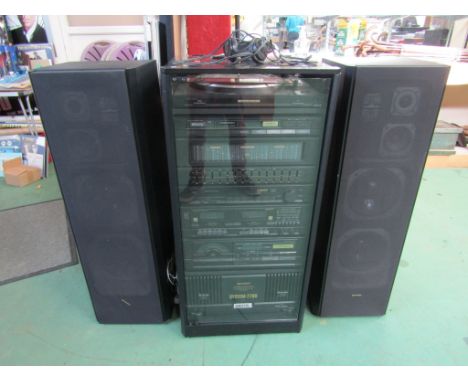 A Sharp 7700 integrated component sound system comprising turntable, tuner, stereo amplifier, double cassette deck, CD player