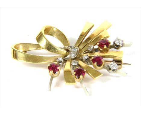 A gold ruby and diamond spray brooch, circular mixed cut rubies and brilliant and eight cut diamonds, claw set to knife edge 