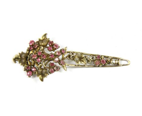 A Sri Lankan silver gilt ruby Kondakoora hairpin, with boteh shaped finial, set with native cut rubies, to tapered stem and a