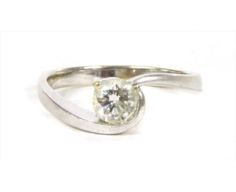 A white gold single stone diamond ring, a brilliant cut diamond, semi rub and claw set, to crossover shoulders and plain shan