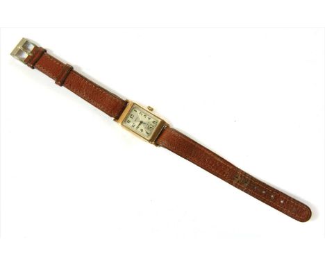 An Art Deco 9ct gold Rotary mechanical strap watch, rectangular case 32 x 23mm, with a silvered quartered dial, black Arabic 