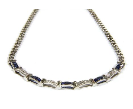 A white gold sapphire and diamond necklace, a curved centrepiece composed of arched bars, alternately channel set with three 