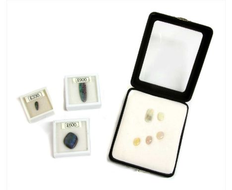 A quantity of unmounted opals, to include three boulder opals, 32.0 x 9.3mm, 23.5 x 19.0mm, 13.2 x 4.3mm, together with two w