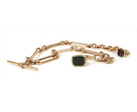 A 9ct rose gold fetter link double Albert chain, with T-bar and swivel fittings. Chester 1918. Suspending two seal fobs. 68.0