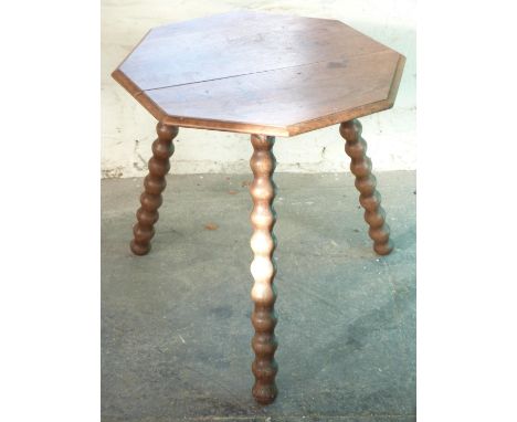 An oak cricket table with bobbin turned legs, H61 x diameter 60cm&nbsp;