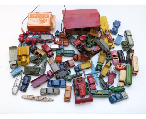 A collection of over sixty Dinky diecast vehicles and tin storage shed, including Blaw Knox Bulldozer, Observation Coach, Mui