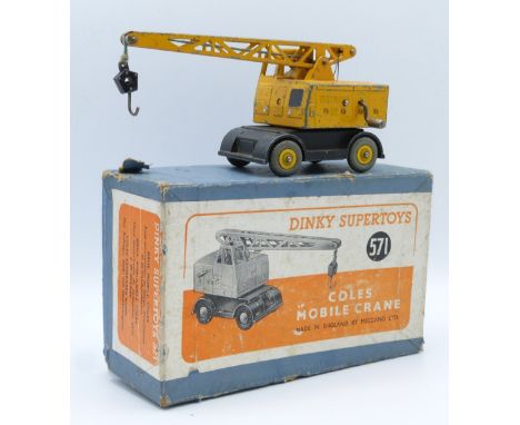 Dinky Supertoys diecast model Coles Mobile Crane with hoisting jib raising and slewing movements, black bed, yellow body and 