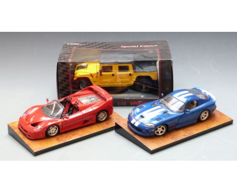 Three 1:18 scale diecast model vehicles comprising Maisto Special Edition Hummer Soft Top, Ferrari and Dodge Viper, one in or