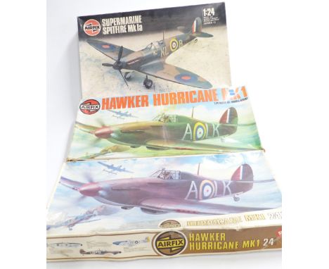 Three Airfix 1:24 scale model kits comprising two Hawker Hurricane Mk1 14002-5 and 09502-8 and Spitfire Mk1a 12001, all in or